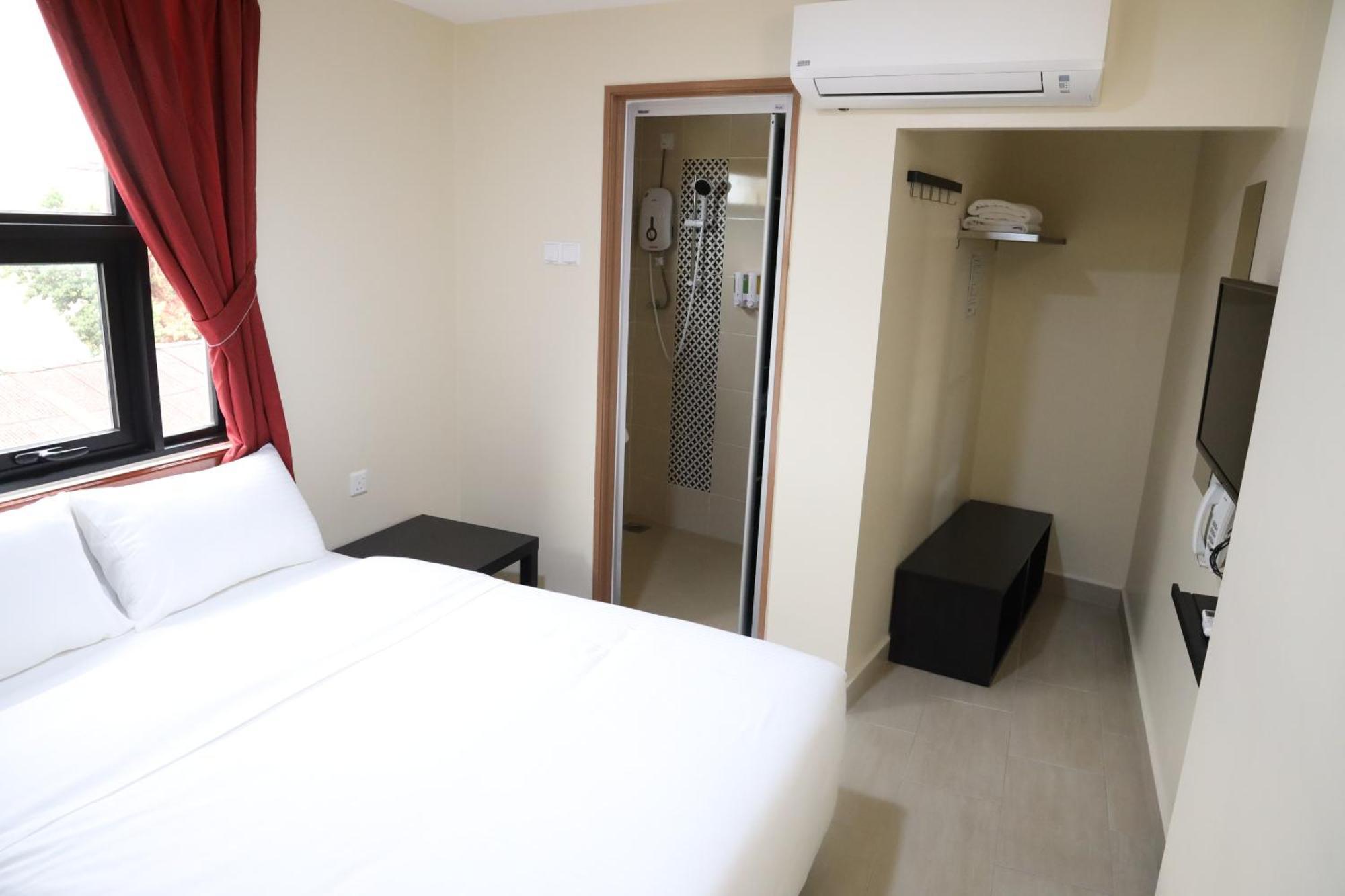 Capital O 90897 Island City Hotel Джорджтаун Экстерьер фото